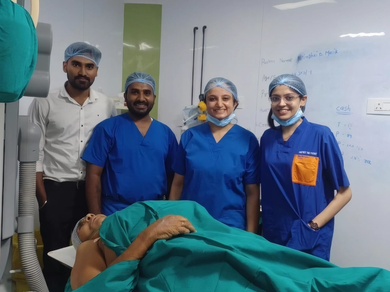 Dr. Mausam Mody with the cardiac catheterization laboratory team during patient care