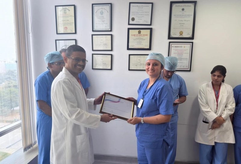 Dr. Mausam Mody receiving a certificate of recognition during a clinical training program